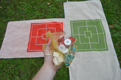 Duschtuch "Mühle" mit Spielsteinen